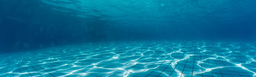 Underwater view of a clean, well-maintained in-ground pool